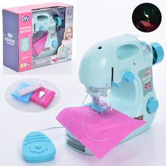 Детская игрушечная швейная машинка 7982B 19см, шиє, тканина, нитки, свет, на батарейках